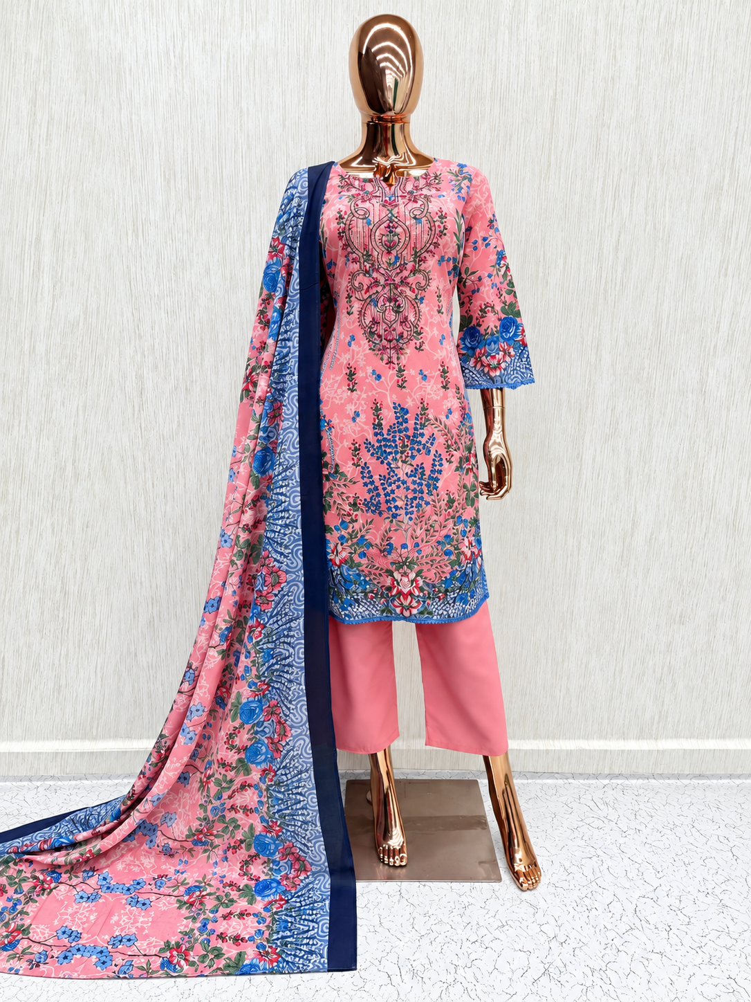 Model wearing festive pink Pakistani suit